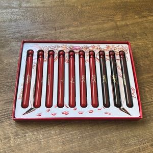 A set of Christian Louboutin's ten fragrances in travel-sized vials.